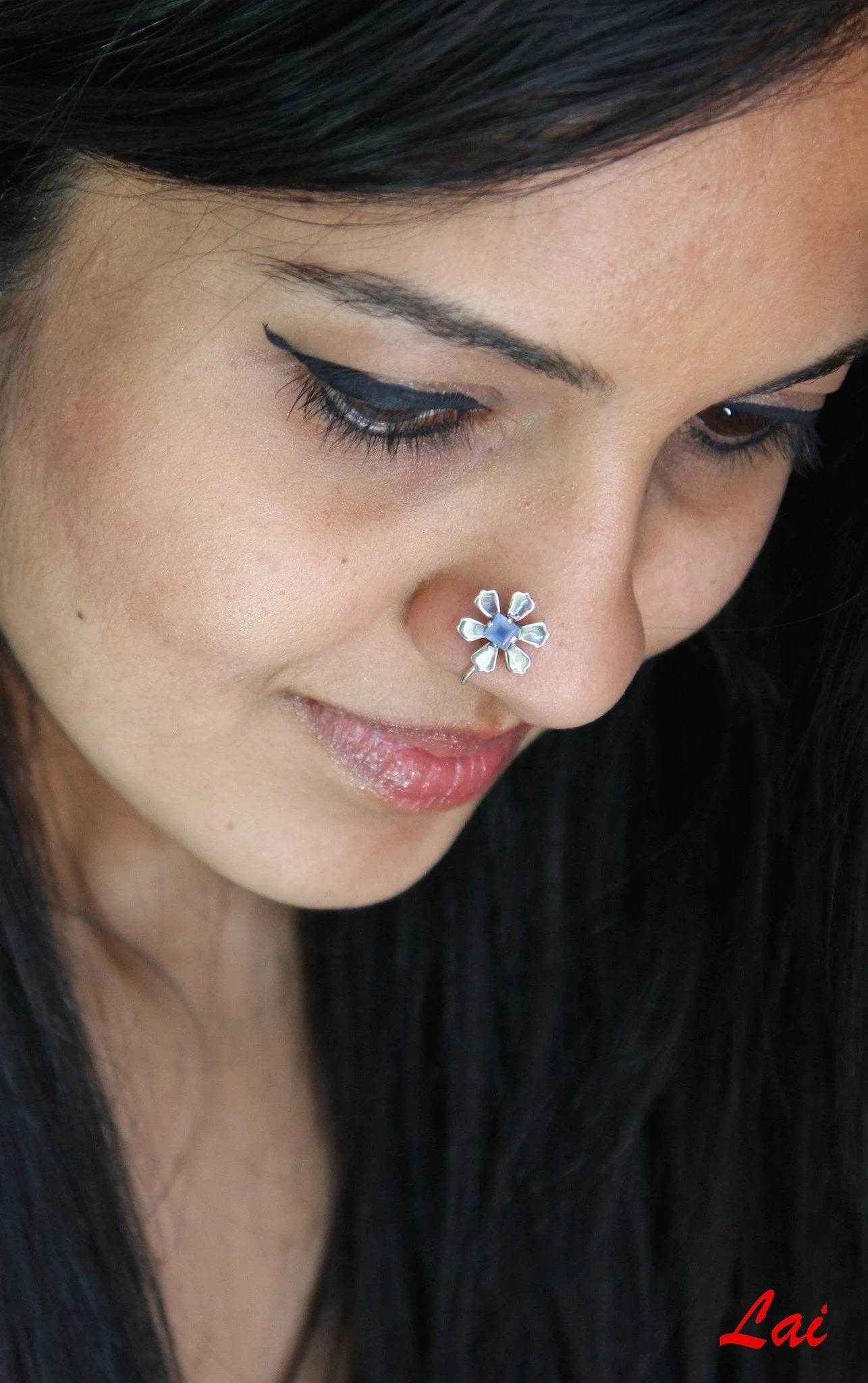 Not-shy, floral nose pin with a square blue stone